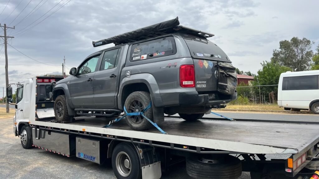 Tow truck loading a stranded hatchback on the Monash Freeway (M1) near Warrigal Road exit, outbound — We Tow Anything Melbourne.