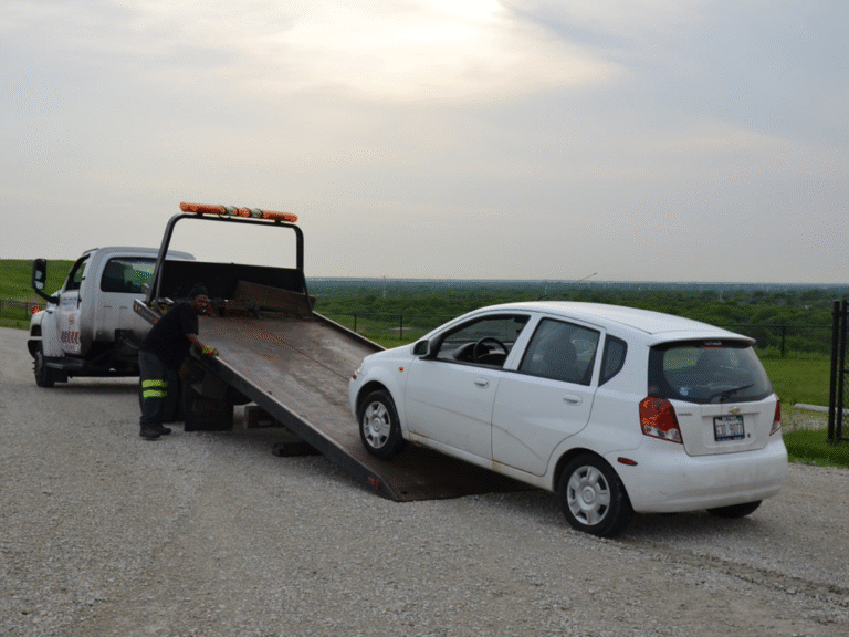 Flatbed tow truck loading a car on Bay Street Port Melbourne near cafes