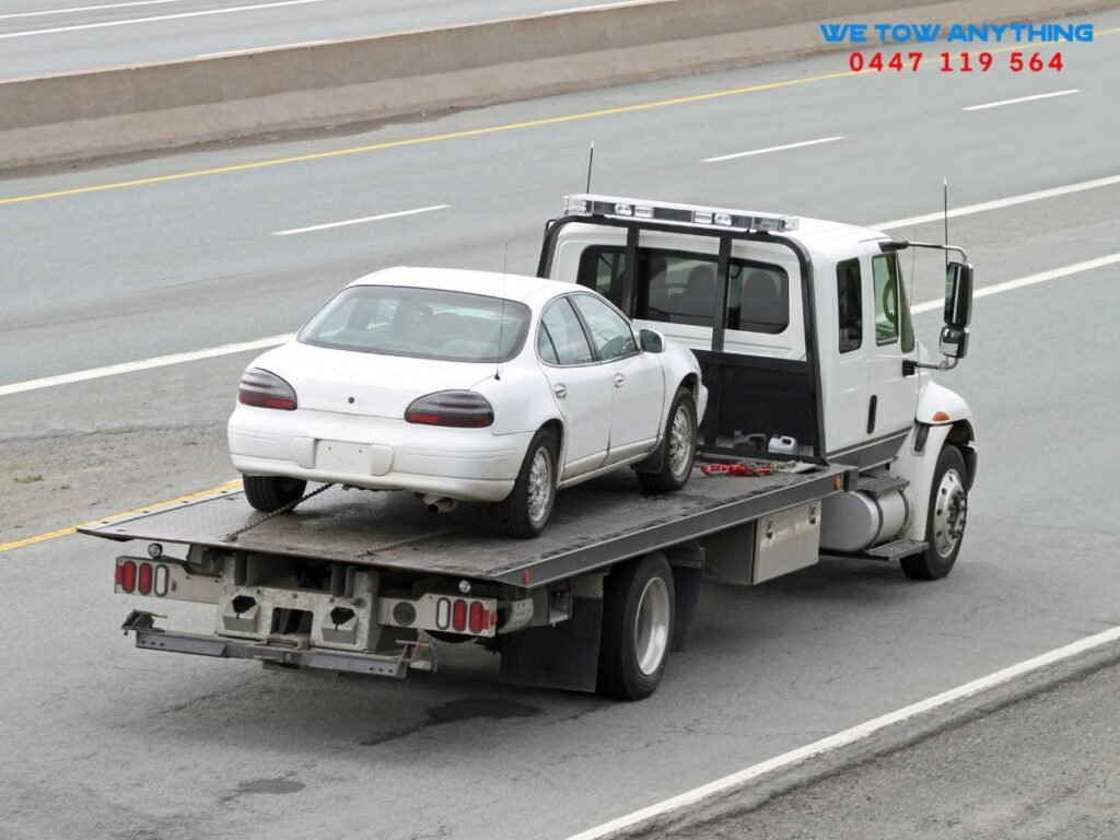 VicRoads accident towing rights Victoria — tow truck operator assisting motorist on Hume Freeway near Strathbogie Shire